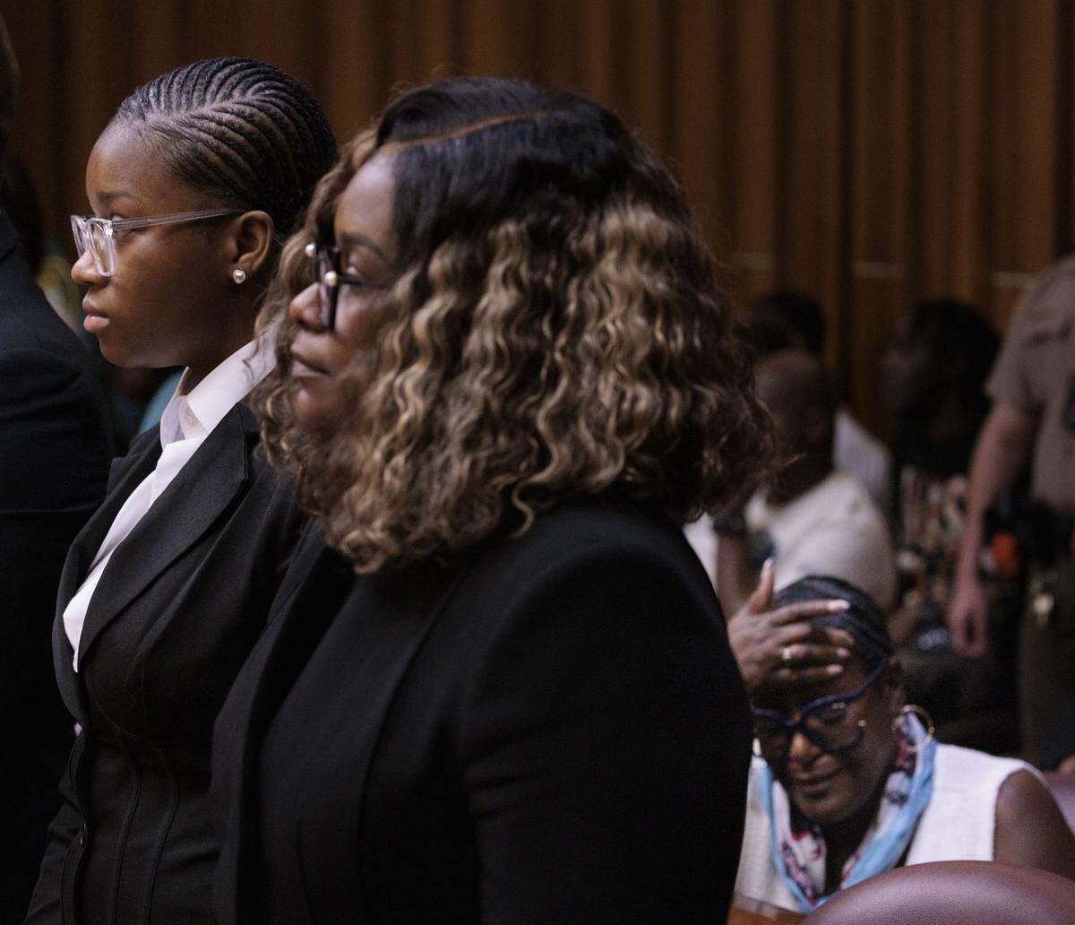 Jahara Malik, now 18, far left, stands for her sentencing on Tuesday, May 5, 2026.